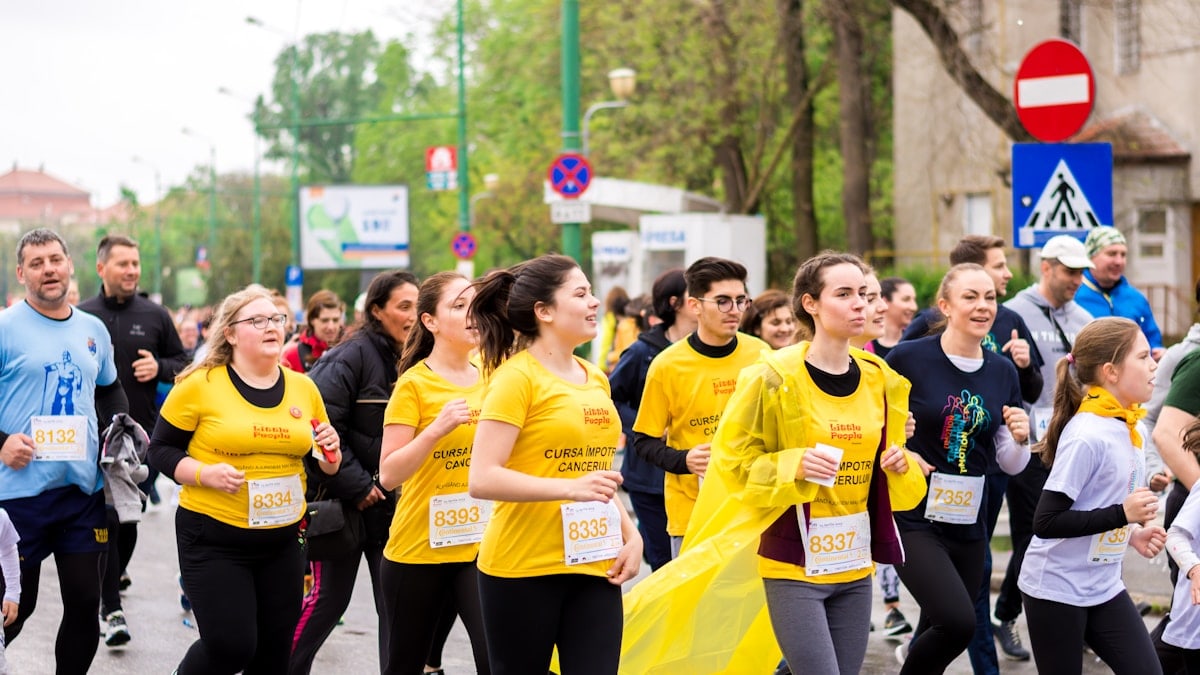 men and women running on street